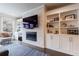 Bright living room featuring custom built-ins and modern fireplace at 4104 Townsend Ln, Dunwoody, GA 30346