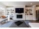 Inviting living room with fireplace, built-in shelving, and comfortable seating area at 4104 Townsend Ln, Dunwoody, GA 30346