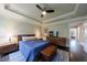 Comfortable bedroom with stylish furniture, hardwood floors, and a modern ceiling fan at 4104 Townsend Ln, Dunwoody, GA 30346