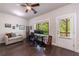 Bright office space featuring a ceiling fan, window views, and exterior door to balcony at 4104 Townsend Ln, Dunwoody, GA 30346