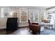 Bright sitting area with hardwood floors, large windows, and stylish furniture at 4104 Townsend Ln, Dunwoody, GA 30346