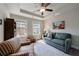 Comfortable sitting room with large windows, a sofa, and coffered ceilings at 4104 Townsend Ln, Dunwoody, GA 30346