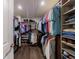 Spacious walk-in closet with custom shelving and ample hanging space for organized storage at 4104 Townsend Ln, Dunwoody, GA 30346