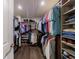 Spacious walk-in closet featuring custom shelving for clothing, shoes, and accessories at 4104 Townsend Ln, Dunwoody, GA 30346