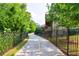 View of the walkway surrounded by mature landscaping at 4104 Townsend Ln, Dunwoody, GA 30346