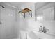 Clean bathroom features a shower and a white single sink vanity, perfect for a refreshing start at 5839 Darry Cir, Norcross, GA 30093