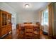 Bright dining room featuring a wooden table, hutch, and natural light at 5839 Darry Cir, Norcross, GA 30093