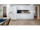 Spacious kitchen with stainless steel appliances, white cabinetry, and tile flooring at 5839 Darry Cir, Norcross, GA 30093
