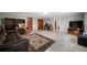 Spacious living room with tile flooring, TV and a comfortable leather sofa and recliner at 5839 Darry Cir, Norcross, GA 30093