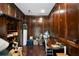 Office space offers rich wood paneling and flooring, creating a unique atmosphere for work and storage solutions at 5839 Darry Cir, Norcross, GA 30093