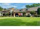 Stunning two-story brick home features a well manicured front yard and attached garage at 1695 Whitley Rd, Dacula, GA 30019