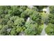 Aerial view of a property surrounded by lush trees, showcasing its private, wooded location at 3726 Scotts Mill Run, Peachtree Corners, GA 30096