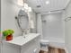 Bathroom featuring a modern vanity, an oval mirror, and a shower and tub combination at 3726 Scotts Mill Run, Peachtree Corners, GA 30096