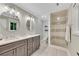 Elegant bathroom with dual vanity, quartz countertops, and a walk-in shower at 3726 Scotts Mill Run, Peachtree Corners, GA 30096