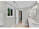 Bright bathroom features double sinks, a modern vanity, and a window for natural light at 3726 Scotts Mill Run, Peachtree Corners, GA 30096