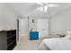 Bright bedroom with a ceiling fan, white trim, and a closet with double doors at 3726 Scotts Mill Run, Peachtree Corners, GA 30096