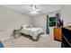 Cozy bedroom with neutral tones, a ceiling fan, and a view of the outdoors at 3726 Scotts Mill Run, Peachtree Corners, GA 30096