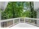 Back deck overlooking a verdant, wooded backyard at 3726 Scotts Mill Run, Peachtree Corners, GA 30096