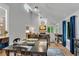 Bright dining space with vaulted ceilings, seamlessly connecting to an open-concept living area with fireplace at 3726 Scotts Mill Run, Peachtree Corners, GA 30096