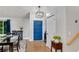 Bright entryway featuring hardwood floors, an eye-catching blue front door, and access to the dining area at 3726 Scotts Mill Run, Peachtree Corners, GA 30096