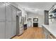 Modern kitchen features a large island, stainless steel appliances, and gray custom cabinetry at 3726 Scotts Mill Run, Peachtree Corners, GA 30096