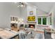 Cozy living room features a stone fireplace, hardwood floors, and a bay window, creating a warm atmosphere at 3726 Scotts Mill Run, Peachtree Corners, GA 30096