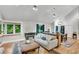 Bright living room with hardwood floors, stylish furniture, and lots of natural light at 3726 Scotts Mill Run, Peachtree Corners, GA 30096