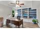 Home office space featuring wood floors, built-in shelves, and a modern ceiling fan at 3726 Scotts Mill Run, Peachtree Corners, GA 30096