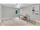 Minimalist office space with natural light, built-in shelving, and neutral carpet at 3726 Scotts Mill Run, Peachtree Corners, GA 30096