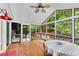 Inviting screened porch offering picturesque views of lush greenery and nature at 3726 Scotts Mill Run, Peachtree Corners, GA 30096