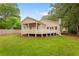 Spacious backyard features a well-maintained lawn and a back porch, great for outdoor enjoyment at 1036 Dell Se Ave, Smyrna, GA 30080