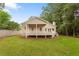 A well manicured backyard and covered porch offer a perfect spot for relaxation and entertainment at 1036 Dell Se Ave, Smyrna, GA 30080