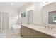 Bathroom featuring double sinks, modern fixtures, and a standalone soaking tub at 1036 Dell Se Ave, Smyrna, GA 30080