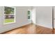 Bedroom features hardwood floors, white trim and two large windows at 1036 Dell Se Ave, Smyrna, GA 30080