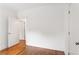 Bright room featuring hardwood floors, white trim and an open door frame at 1036 Dell Se Ave, Smyrna, GA 30080