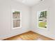 Bright room features hardwood floors, white trim and two large windows at 1036 Dell Se Ave, Smyrna, GA 30080