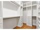 Walk-in closet with custom shelving and hardwood floors at 1036 Dell Se Ave, Smyrna, GA 30080