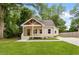 Charming single-story home with a well-manicured lawn and inviting front porch at 1036 Dell Se Ave, Smyrna, GA 30080