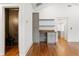 Hallway area with hardwood floors, built-in shelves and cabinets, and access to a bathroom at 1036 Dell Se Ave, Smyrna, GA 30080