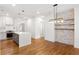 Spacious kitchen with large island, stainless steel appliances, stone accent wall and modern lighting at 1036 Dell Se Ave, Smyrna, GA 30080