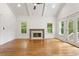 Bright living room with vaulted ceilings, fireplace and doors to backyard at 1036 Dell Se Ave, Smyrna, GA 30080