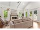 Living room with fireplace, stylish furniture, and lots of natural light at 1036 Dell Se Ave, Smyrna, GA 30080