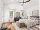 A main bedroom showcasing hardwood floors, high ceilings, and natural light at 1036 Dell Se Ave, Smyrna, GA 30080