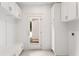 Well-lit mudroom with white cabinets, bench seating, and access to the outside at 1036 Dell Se Ave, Smyrna, GA 30080