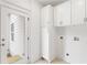 Mudroom with white cabinets, built-in storage, and access to the backyard at 1036 Dell Se Ave, Smyrna, GA 30080