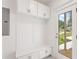 Convenient mudroom features built-in storage and bench with easy access to outdoors at 1036 Dell Se Ave, Smyrna, GA 30080