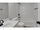 A bathroom featuring a white shower-tub combination, a sink, and matte black hardware at 1335 Seneca, Cumming, GA 30041