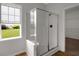 Bathroom features a glass-enclosed shower and a bright window view at 1335 Seneca, Cumming, GA 30041
