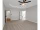 Bedroom with ceiling fan, en suite bathroom, and a view to a hallway at 1335 Seneca, Cumming, GA 30041