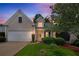 Charming single-Gathering home with attached garage and a well-maintained front yard at sunset at 1335 Seneca, Cumming, GA 30041